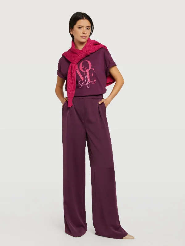 Loose trousers with elasticated waistband